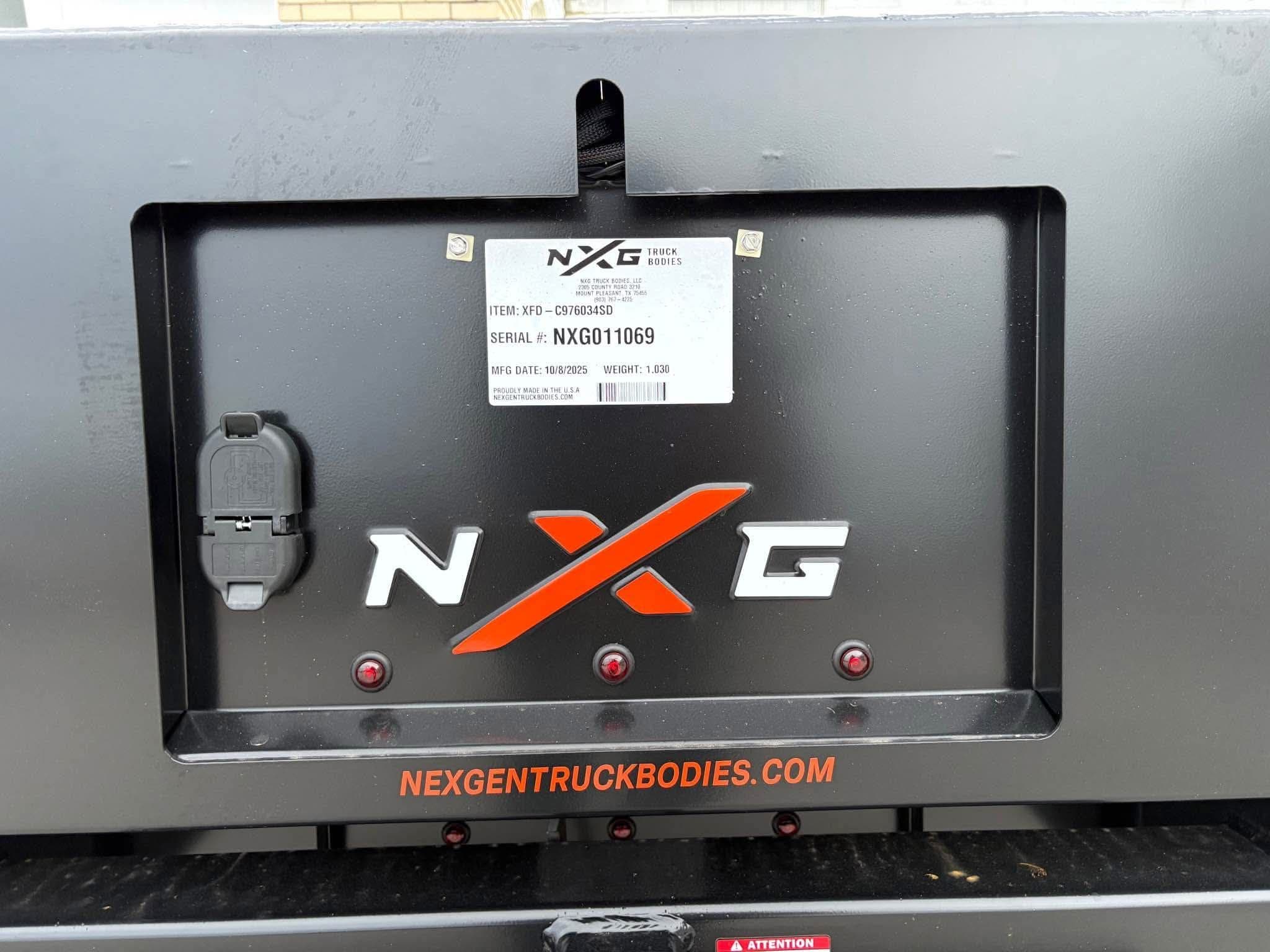 NXG data plate reading item XFD-C976034SD, serial NXG011069, build date 10/8/2025, weight 1,030 lbs